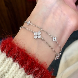 Elegant double-layered silver bracelet with sparkling zircon four-leaf flower charms for women
