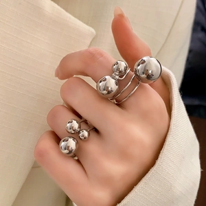 Polished silver sphere rings set with minimalist open design and high mirror finish