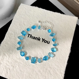 Close-up of sky blue zircon bracelet with geometric crystals and adjustable silver chain