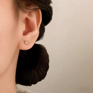 Minimalist star stud earrings with pavé cubic zirconia in a gold-plated finish