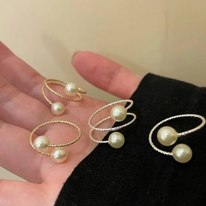 Elegant set of four twisted pearl wrap rings in gold and silver finish for women