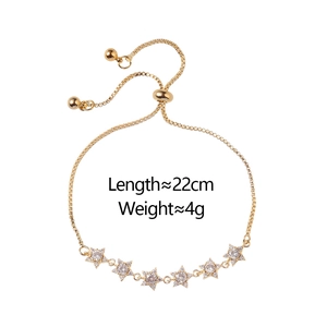 Adjustable gold star bracelet with cubic zirconia stones, length 22cm and weight 4g