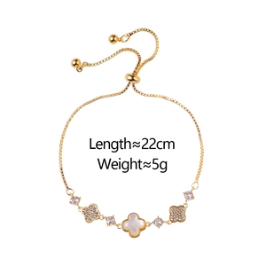 Adjustable gold clover bracelet with white shell and pavé stones, 22cm length