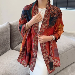 Detailed view of luxury red floral shawl with vintage patterns and elegant silk texture