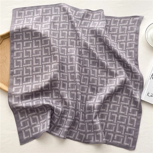 Close-up of lightweight mauve square scarf featuring white herringbone pattern texture