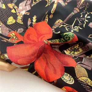 Detailed macro view of high-quality silk-like square scarf with intricate floral patterns