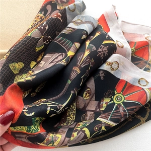 Retro floral silk square scarf with butterfly and chain print in black and orange colors