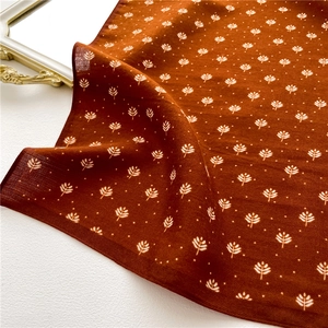 Caramel leaf print silk scarf with herringbone texture on elegant white background