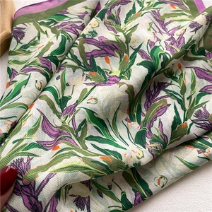 Macro detail of floral pattern and fine twill texture on purple cotton-linen feel scarf
