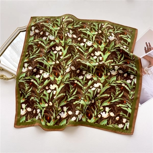 Close-up of vintage floral silk scarf with white tulips and double-colored border
