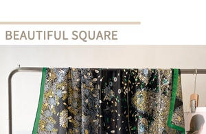 Detail of vintage square floral silk scarf with green border on white background