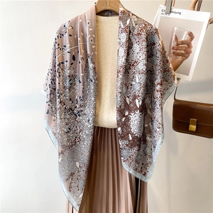 Retro oversized floral print silk scarf styled with beige knitwear and a brown leather bag