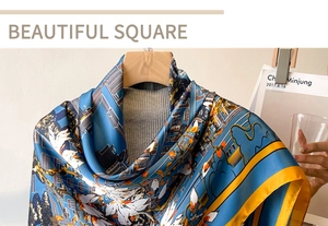 Detailed texture of the blue square silk scarf with floral patterns and yellow borders