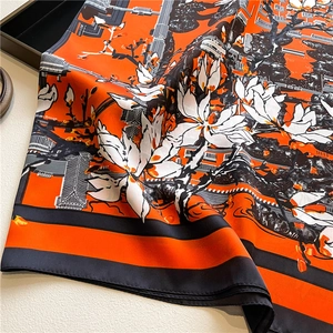 Orange and black floral silk satin square scarf with artistic architectural patterns