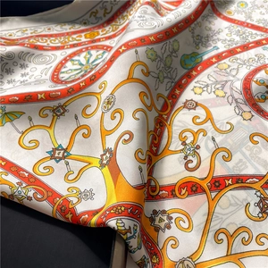 Detailed macro shot of geometric flower pattern and silky texture on a square scarf