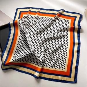 Detail of soft satin square scarf with vintage polka dots and multi-color stripe patterns