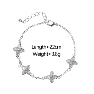 Detail of silver clover bracelet featuring lobster clasp and adjustable extender chain