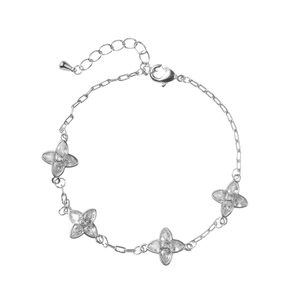 Elegant silver four-leaf clover bracelet with sparkling cubic zirconia on a minimalist chain