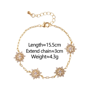 Detail of gold snowflake bracelet with dimensions showing 15.5cm length and 3cm extension