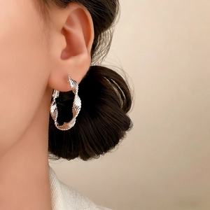Fashionable silver twisted rope hoop earring for women with textured metal finish