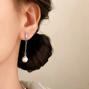 Elegant silver tassel earrings featuring micro-set zircon leaves and white round pearls