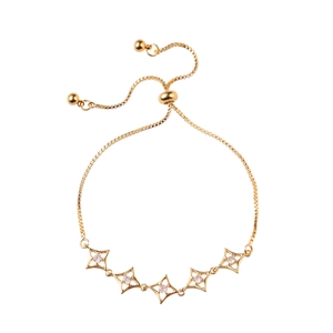 Gold adjustable star bracelet with micro-paved cubic zirconia on white background