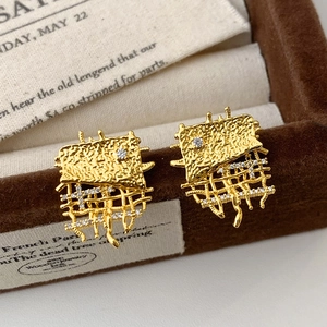 Elegant gold woven earrings with textured metal square and zircon mesh details