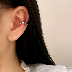 Minimalist pearl ear cuff in silver plating featuring a layered bead design for women
