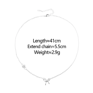 Detailed view of silver bow necklace chain with 41cm length and 5.5cm extension chain