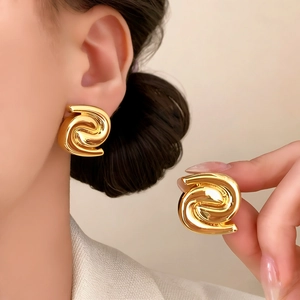 Minimalist gold spiral geometric stud earrings for women with a high-polished metallic finish