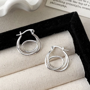 Minimalist silver double-layered round hoop earrings in a premium jewelry display box