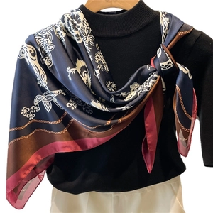 Floral print 110cm satin silk scarf with chain pattern draped on black sweater
