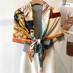 French style draping of a large satin silk scarf with abstract geometric floral patterns