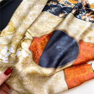Close-up of lightweight floral silk scarf with retro oil painting print and smooth texture