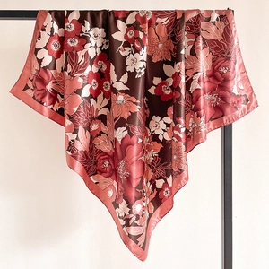 Detail of vintage floral silk scarf with elegant brown and red peony patterns and fine edges