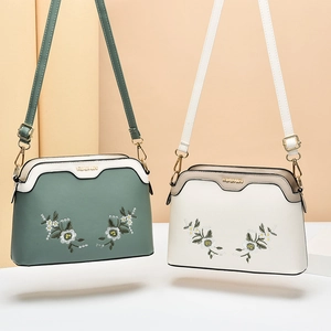 Chic floral embroidered shell crossbody bags in dark green and cream white with gold hardware