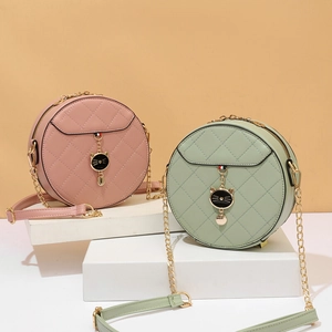 Chic quilted round crossbody bags in pink and sage green with metal chain straps