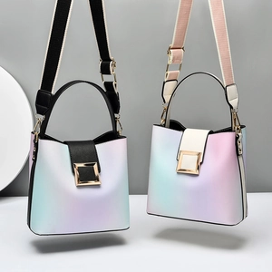 Minimalist gradient bucket bag with gold square clasp and detachable wide strap