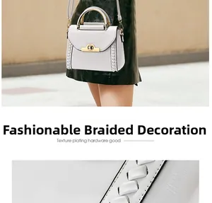 Detail view of white crossbody bag featuring intricate woven leather edges and gold metal clasp