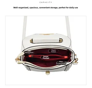 Interior view of white PU leather bag showing layered compartments and red lining detail