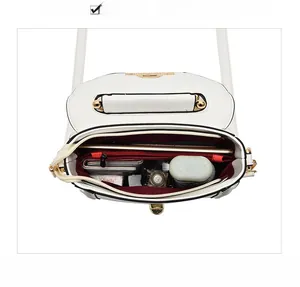 Interior view showing the large storage capacity of the white leather crossbody bag