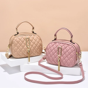 Quilted crossbody bags in beige and pink synthetic leather with elegant tassel charms