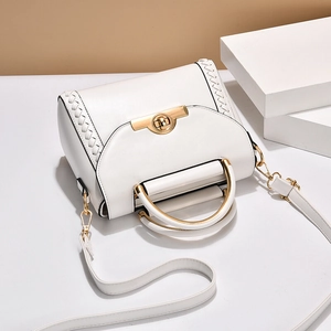 Elegant white leather handbag with gold twist lock and woven texture side detail