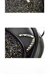 Detail of sequined black kitten backpack with crystal cat ears and gold zipper