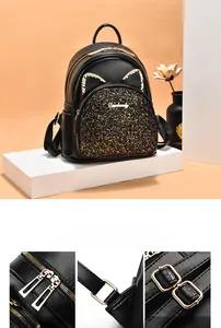 Detail of high-quality gold hardware, zippers, and adjustable straps on cat-ear sequin backpack