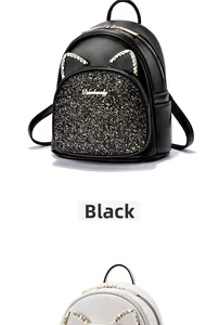 Macro shot of stylish cat-ear mini backpacks with colorful sequins and shiny rhinestones