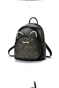 Detail of black leather mini backpack featuring glitter sequins and rhinestone cat ears