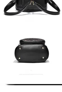 Detail of the black leather sequined backpack showing the back straps and metal protective feet