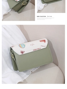 Detail of trendy mini flap bag featuring colorful hot air balloon and architecture prints