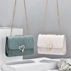 Elegant quilted saddle crossbody bags with heart lock and gold chain strap in two colors